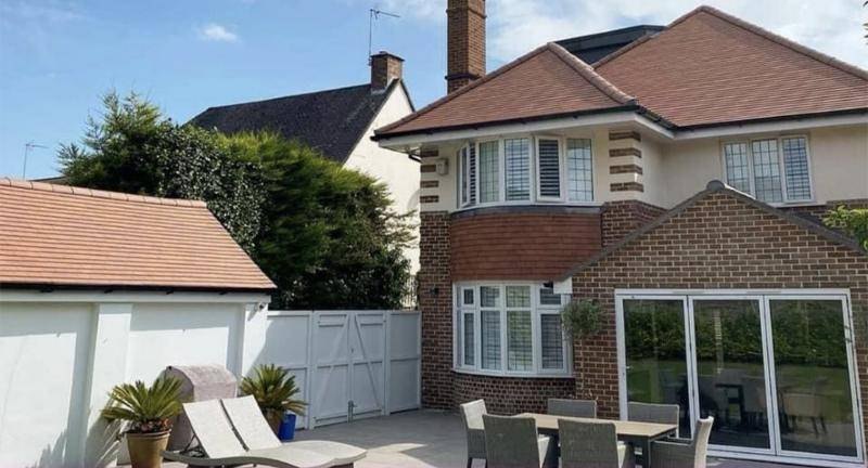 Completed house and garage re-roof viewed from the garden